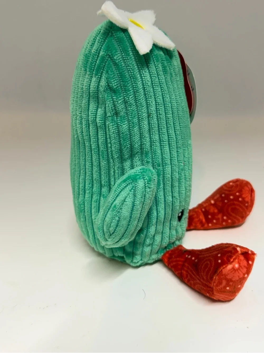 Green Cactus Plush Toy with Red Feet and White Flower